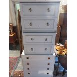 MELAMINE CHEST OF FOUR DRAWERS AND A PAIR OF MELAMINE TWO DRAWER BEDSIDE CHESTS