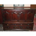 EARLY ANTIQUE OAK PANELLED HOUSEKEEPERS CHEST FITTED WITH FIVE DRAWERS AND TWO CUPBOARD DOORS