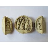 HEAVILY CARVED ANTIQUE IVORY THREE SECTION GLOBULAR TRIPTYCH DEPICTING RELIGIOUS SCENES (HINGES AT