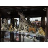 COLLECTION OF VARIOUS UNGLAZED CERAMIC DOGS