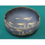 JAPANESE UNGLAZED BLACK SATSUMA WAVE EDGED BOWL WITH GILDED MOUNTAIN SCENE DECORATION,