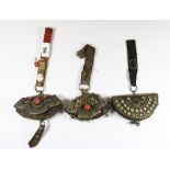 3 19th and early 20th century Tibetan leather and white metal purses