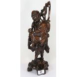 An early 20th century Chinese carved hardwood figure of Lohan H41cms
