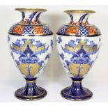 A pair of MacIntyre hand painted and gilt vases, one with minor rim chip H31cms