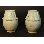 A pair of Chinese Song dynasty style funerary vases (probably of the period) H15.5cms