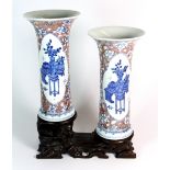 A pair of 19th/20thC Chinese hand painted porcelain vases with under glazed blue and red