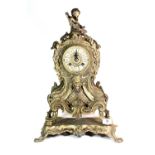 A large ornate brass mantle clock (51cm)