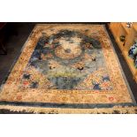 A large Chinese washed wool rug 305cm x 248cm, some discolouration.