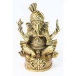 An interesting Tibetan gilt bronze figure of the elephant God Ganesh wearing a turban, H 17cm