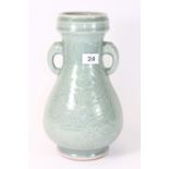 A Chinese incised and celadon glazed vase, H 30cm