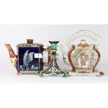 A 19th century majolica teapot, a Wedgwood majolica candlestick and a further oriental design teapot