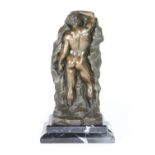 An interesting cast bronze male nude figure on a black marble base