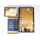 An old carved bone and bamboo mahjong set and counters