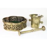 An 18th century bronze pestle and mortar and a bronze centre piece