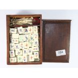 A cased mid 20th century bone and bamboo mahjong set
