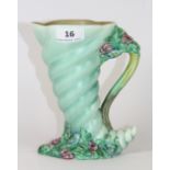 A Clarice Cliff Cornucopia jug, H 18cm