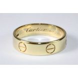 An 18ct yellow gold gents Cartier love ring. Size Y