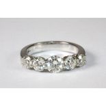 A superb 18ct white gold 5 stone diamond ring total weight approx. 2.1ct, centre stone approx. .75ct