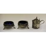 A pair of hallmarked silver salts and a set of hallmarked silver mustard pots