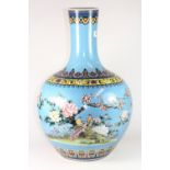 A large Chinese hand painted porcelain vase decorated with birds among foliage, H 54cm, Qianlong