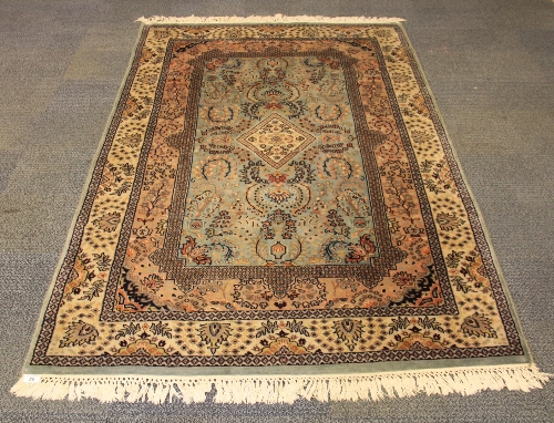 A fine hand-woven Persian wool rug, 200 x 125cm