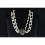 A 3 row cultured pearl necklace on a white metal and mother of pearl clasp