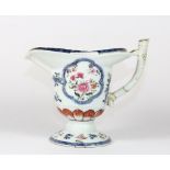 An 18th century continental porcelain jug in the oriental palette with stapled repair to handle, H