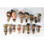 A collection of Black Forest wooden wine bottle stoppers and others