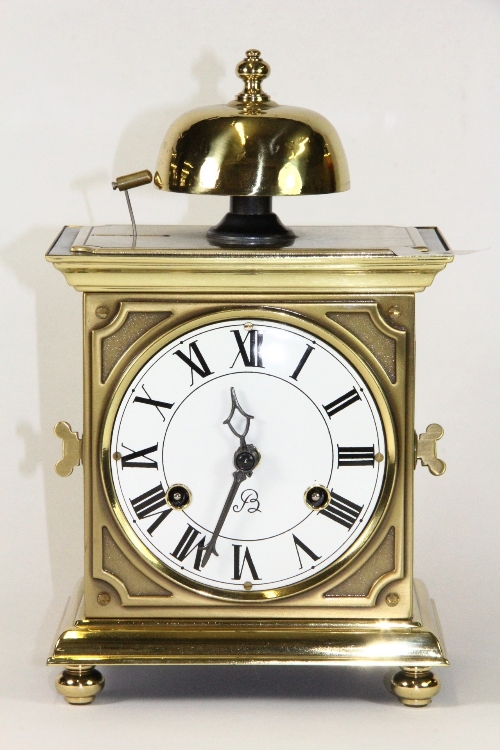 A striking Dutch brass mantle clock
