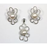 A cultured pearl and stone set pendant and earrings