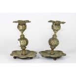 A pair of 19th century ornate brass candlesticks, H 13.5cm