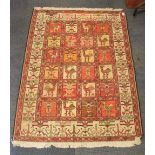A hand woven eastern rug, 106cm x 147cm