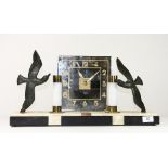 An Art Deco marble and bronze electric clock with illuminated pillars