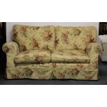 Two seater settee with washable chintz cotton loose covers