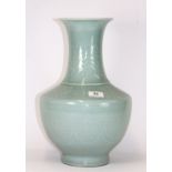 A fine quality Chinese celadon glazed and relief decorated porcelain vase with 4 character mark to