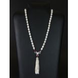 A lovely cultured pearl and stone set necklace