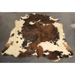 A large cow skin rug 220cm x 208cm