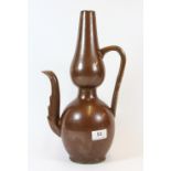 A 19th / early 20th century Chinese brown glazed porcelain ewer, H 36cm