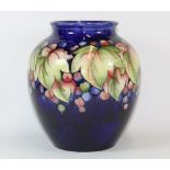 A large early Moorcroft tubelined vase with grape and vine design, H 25cm