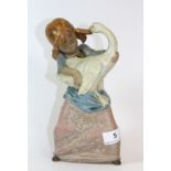 A Lladro terracotta figure of a girl with a goose, H 24cm (A/F)