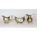 A hallmarked silver sugar bowl and milk jug together with a hallmarked silver milk jug