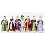 A set of 7 hand painted continental porcelain figures of King Henry VIII and his 6 wives, H 28cm