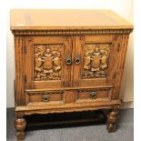 A carved oak 2 door 2 drawer cabinet, W 76cm, H 84cm