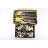 An extensive silver plated cutlery set with a quantity of knives.