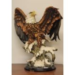 A very large Fine Art Collection resin figure of an eagle, H 62cm