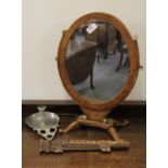A dressing table mirror, a pewter chamber stick and a rosewood flute.