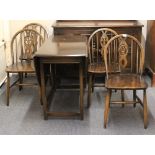 An Ercol beech wood drop leaf cottage dining suite together with an Ercol dresser.