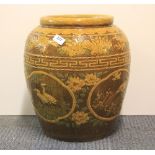 A large Chinese glazed stoneware jar. H. 40 cm.