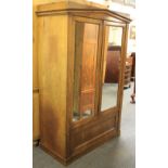 A double door mahogany veneered wardrobe, W. 113cm, H. 172cm.