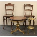 A pair of bentwood chairs, a gilt and mahogany coffee table and a brass plant stand.